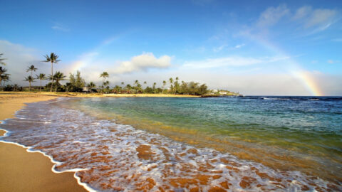 A rainbow over Poipu Beach in Maui