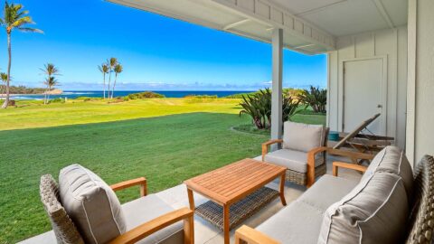 The covered lanai with an ocean view at Poipu Sands at Poipu Kai #514