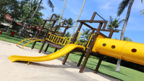 A playground with a slide, bridge, and more at a park on Kauai