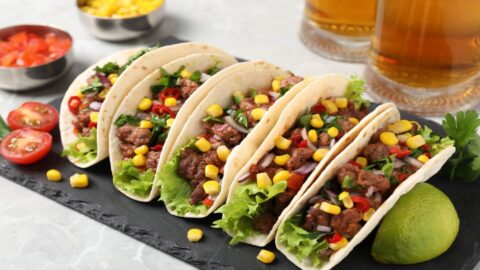 A tray of tacos with lime and other food at a Mexican restaurant on Kauai