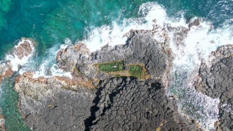 An aerial view of Queen's Bath, one of the top things to do in Princeville